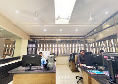 Sai Machine Tools office staff working at desks in Indore